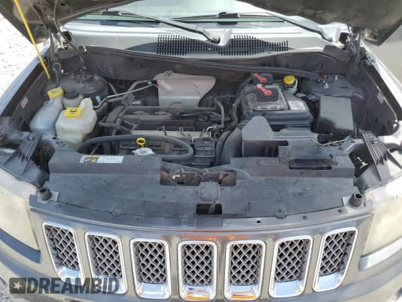 2015 Jeep Compass Latitude with VIN 1C4NJCEB9FD296054, listed as a Copart auction lot 65058744 with 122,604 mi miles and Salvage title. Bid and sale history available at DreamBid. Image 12.