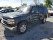 2005 Chevrolet Tahoe LT with VIN 1GNEC13T05R163640, listed as a Copart auction lot 61548065 with 370,124 mi miles and Salvage title. Bid and sale history available at DreamBid. Image 1.