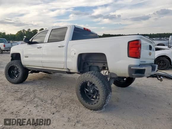 2017 Chevrolet Silverado 1500 LT with VIN 3GCPCREH7HG232224, listed as a Copart auction lot 84614215 with 104,344 mi miles and Salvage title. Bid and sale history available at DreamBid. Image 2.
