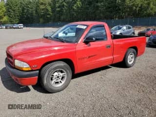 1999 Dodge Dakota SLT with VIN 1B7FL26Y7XS148560, listed as a Copart auction lot 84033715 with 159,620 mi miles and Salvage title. Bid and sale history available at DreamBid. Image 1.
