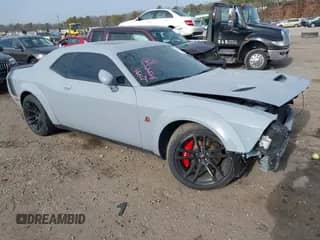 2021 Dodge Challenger R/T Scat Pack Widebody with VIN 2C3CDZFJ5MH551990, listed as a IAAI auction lot 41322434 with 33,916 mi miles and . Bid and sale history available at DreamBid. Image 1.