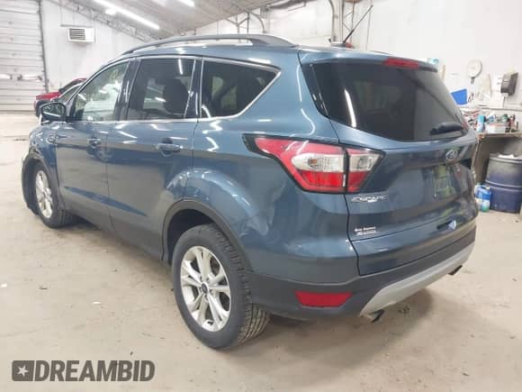 2018 Ford Escape SE with VIN 1FMCU9GD8JUB66187, listed as a IAAI auction lot 43298016 with 76,985 mi miles and . Bid and sale history available at DreamBid. Image 3.