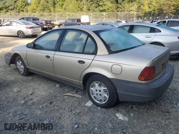 1997 Saturn SL с VIN 1G8ZH5285VZ365951, выставлен на аукционе Copart как лот 70902264 с пробегом 104 781 миль миль и Списание • Salvage title. История ставок и продаж доступна на DreamBid. Изображение 2.