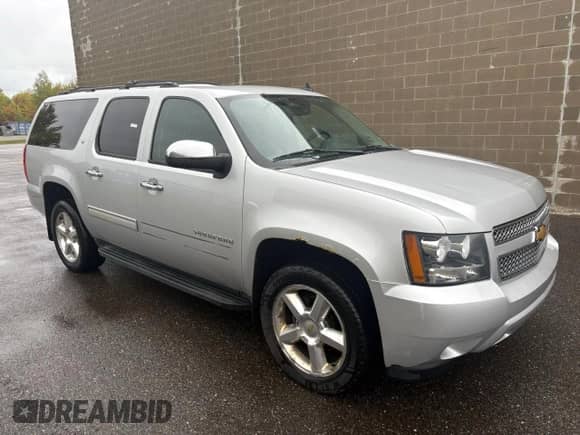 2013 Chevrolet Suburban LT with VIN 1GNSKJE71DR263248, listed as a Copart auction lot 86150925 with 197,711 mi miles and Clean title. Bid and sale history available at DreamBid. Image 1.
