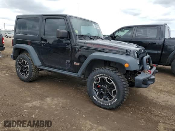 2013 Jeep Wrangler Rubicon 10th Anniversary with VIN 1C4BJWCG7DL677164, listed as a Copart auction lot 59992505 with 120,000 mi miles and Salvage title. Bid and sale history available at DreamBid. Image 4.