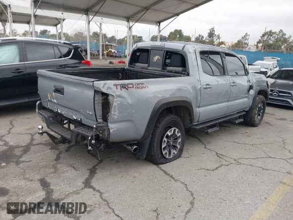 2021 Toyota Tacoma SR5 with VIN 3TMAZ5CN8MM140976, listed as a IAAI auction lot 41513243 with 109,786 mi miles and . Bid and sale history available at DreamBid. Image 4.