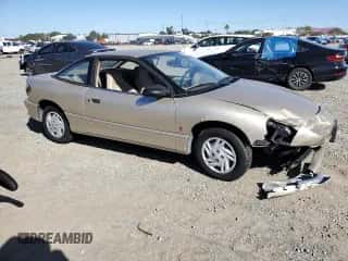 1996 Saturn SC с VIN 1G8ZF1285TZ345887, выставлен на аукционе Copart как лот 49314345 с пробегом 48 622 миль миль и Списание • Salvage title. История ставок и продаж доступна на DreamBid. Изображение 4.