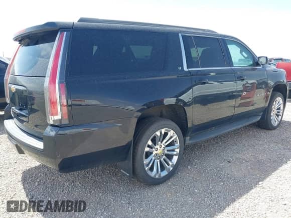 2015 Chevrolet Suburban LT z VIN 1GNSKJKC5FR543579, wystawiony jako IAAI lot #39945561 z przebiegiem 148 453 mil mil oraz . Historia ofert i sprzedaży dostępna na DreamBid. Obrazek 4.