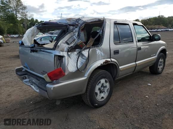 2003 Chevrolet Blazer LS with VIN 1GNDT13X73K152980, listed as a Copart auction lot 71448015 with 102,250 mi miles and Salvage title. Bid and sale history available at DreamBid. Image 3.