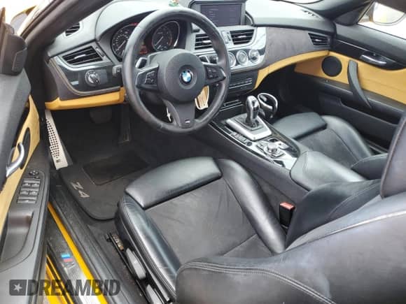 2012 BMW Z4 sDrive28i with VIN WBALL5C57CE716617, listed as a Copart auction lot 61099305 with 76,995 mi miles and Salvage title. Bid and sale history available at DreamBid. Image 8.