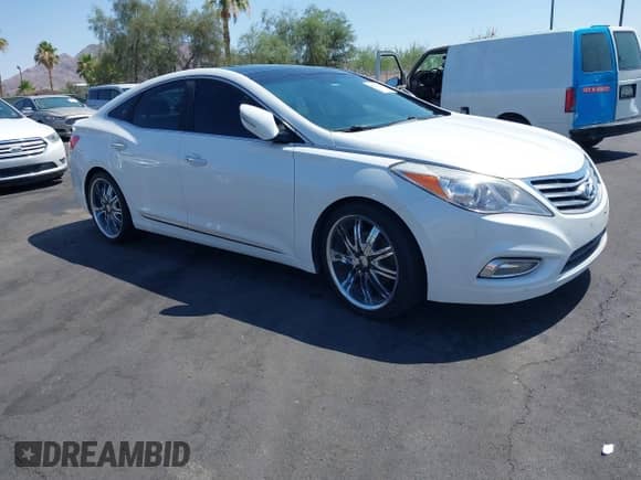 2014 Hyundai Azera Limited z VIN KMHFH4JG2EA333397, wystawiony jako IAAI lot #42610633 z przebiegiem 128 952 mil mil oraz . Historia ofert i sprzedaży dostępna na DreamBid. Obrazek 1.