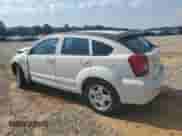 2009 Dodge Caliber SXT with VIN 1B3HB48A89D224125, listed as a Copart auction lot 61968005 with 241,959 mi miles and Salvage title. Bid and sale history available at DreamBid. Image 2.