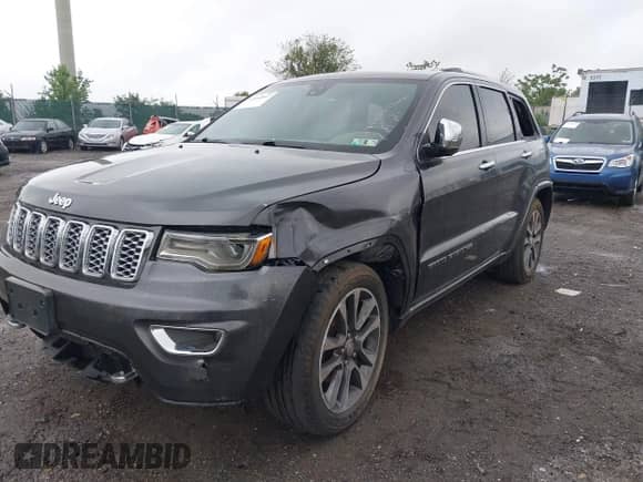 2018 Jeep Grand Cherokee Overland with VIN 1C4RJFCG3JC214710, listed as a IAAI auction lot 42264897 with Not provided miles and . Bid and sale history available at DreamBid. Image 11.