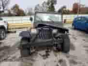 1991 Jeep Wrangler with VIN 2J4FY19P2MJ106558, listed as a Copart auction lot 77743304 with 173,242 mi miles and Salvage title. Bid and sale history available at DreamBid. Image 5.