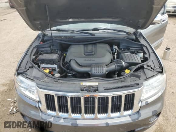 2012 Jeep Grand Cherokee Limited z VIN 1C4RJFBG5CC102608, wystawiony jako Copart lot #70375545 z przebiegiem 103 079 mil mil oraz Szkoda całkowita • Salvage title. Historia ofert i sprzedaży dostępna na DreamBid. Obrazek 11.