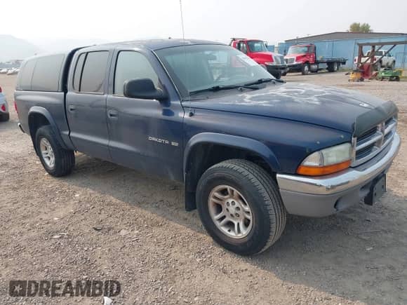 2002 Dodge Dakota SLT z VIN 1B7HG48NX2S682849, wystawiony jako IAAI lot #43032345 z przebiegiem 192 599 mil mil oraz . Historia ofert i sprzedaży dostępna na DreamBid. Obrazek 1.