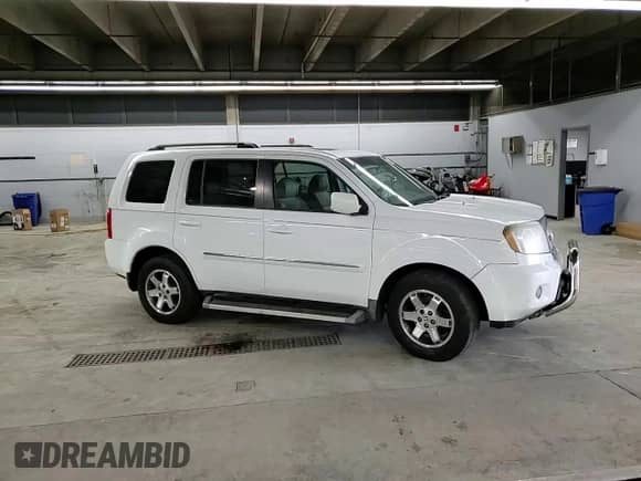 2010 Honda Pilot Touring with VIN 5FNYF3H90AB008883, listed as a Copart auction lot 58435355 with 132,020 mi miles and Salvage title. Bid and sale history available at DreamBid. Image 15.