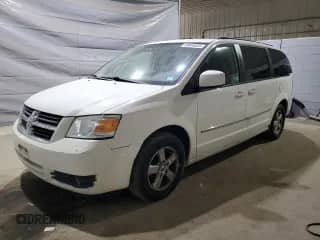 2010 Dodge Grand Caravan SXT z VIN 2D4RN5D17AR499253, wystawiony jako Copart lot #69954035 z przebiegiem 153 984 mil mil oraz Szkoda całkowita • Salvage title. Historia ofert i sprzedaży dostępna na DreamBid. Obrazek 1.