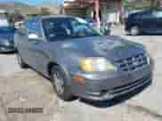 2005 Hyundai Accent GLS z VIN KMHCG35C25U348410, wystawiony jako IAAI lot #41729780 z przebiegiem 166 216 mil mil oraz . Historia ofert i sprzedaży dostępna na DreamBid. Obrazek 1.