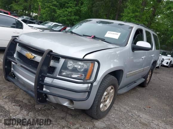 2014 Chevrolet Tahoe LS with VIN 1GNSKAE01ER160917, listed as a IAAI auction lot 42126916 with 185,061 mi miles and . Bid and sale history available at DreamBid. Image 2.