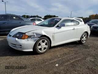 2003 Hyundai Tiburon GT с VIN KMHHN65FX3U096958, выставлен на аукционе Copart как лот 75451144 с пробегом 200 579 миль миль и Списание • Salvage title. История ставок и продаж доступна на DreamBid. Изображение 1.