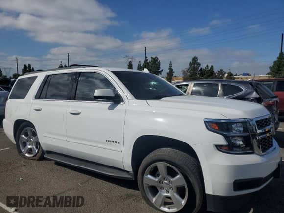2019 Chevrolet Tahoe LS with VIN 1GNSCAEC6KR153562, listed as a Copart auction lot 82231855 with 71,474 mi miles and Salvage title. Bid and sale history available at DreamBid. Image 4.