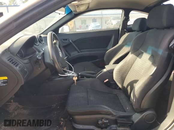 2008 Hyundai Tiburon GS с VIN KMHHM66D38U286530, выставлен на аукционе Copart как лот 80779474 с пробегом 258 212 миль миль и Списание • Salvage title. История ставок и продаж доступна на DreamBid. Изображение 7.