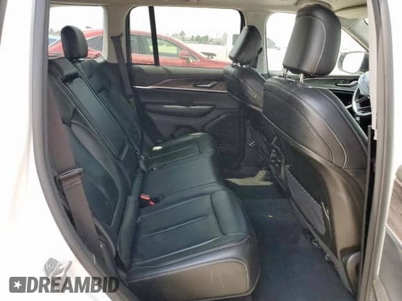 2023 Jeep Grand Cherokee Limited z VIN 1C4RJGBG8PC537277, wystawiony jako Copart lot #57316285 z przebiegiem 56 125 mil mil oraz Szkoda całkowita • Salvage title. Historia ofert i sprzedaży dostępna na DreamBid. Obrazek 11.