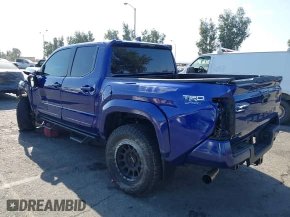 2024 Toyota Tacoma TRD Off Road with VIN 3TMLB5JN8RM074856, listed as a IAAI auction lot 43139396 with 8,137 mi miles and . Bid and sale history available at DreamBid. Image 3.