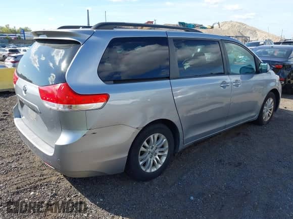 2012 Toyota Sienna XLE with VIN 5TDYK3DCXCS235154, listed as a IAAI auction lot 43366877 with 216,434 mi miles and . Bid and sale history available at DreamBid. Image 4.