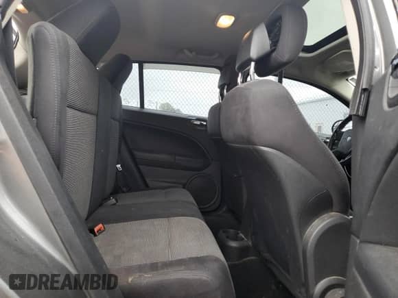 2011 Dodge Caliber Rush z VIN 1B3CB8HB8BD220852, wystawiony jako Copart lot #57391015 z przebiegiem 140 311 mil mil oraz Nie do naprawy • Non repairable. Historia ofert i sprzedaży dostępna na DreamBid. Obrazek 10.