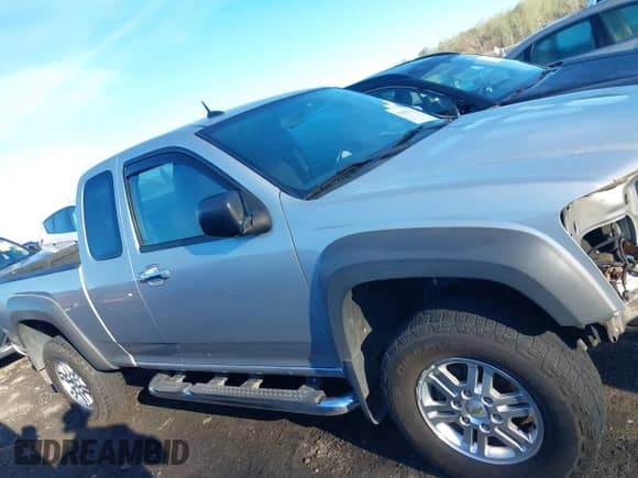 2012 Chevrolet Colorado 1LT z VIN 1GCJTCFEXC8103982, wystawiony jako IAAI lot #41850692 z przebiegiem 149 114 mil mil oraz . Historia ofert i sprzedaży dostępna na DreamBid. Obrazek 14.