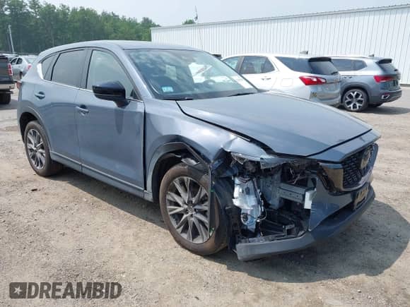 2023 Mazda CX-5 S Carbon Edition z VIN JM3KFBCM5P0179462, wystawiony jako IAAI lot #42451109 z przebiegiem 14 170 mil mil oraz . Historia ofert i sprzedaży dostępna na DreamBid. Obrazek 1.