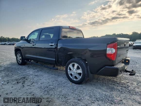 2016 Toyota Tundra Platinum with VIN 5TFGW5F16GX208427, listed as a Copart auction lot 71295365 with 150,184 mi miles and Salvage title. Bid and sale history available at DreamBid. Image 2.