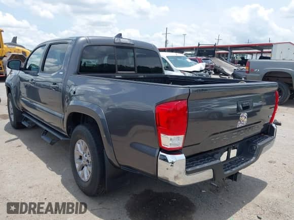 2017 Toyota Tacoma SR5 with VIN 5TFAZ5CN3HX041076, listed as a IAAI auction lot 42424743 with 39,294 mi miles and . Bid and sale history available at DreamBid. Image 3.