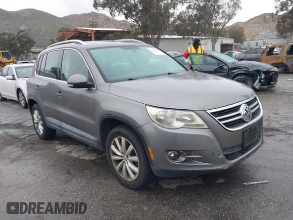 2011 Volkswagen Tiguan SE with VIN WVGAV7AX4BW515069, listed as a IAAI auction lot 41813579 with 100,644 mi miles and . Bid and sale history available at DreamBid. Image 1.