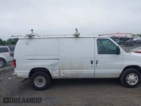 2009 Ford Econoline Cargo Commercial with VIN 1FTNE24W19DA72591, listed as a IAAI auction lot 42613439 with 239,038 mi miles and . Bid and sale history available at DreamBid. Image 6.