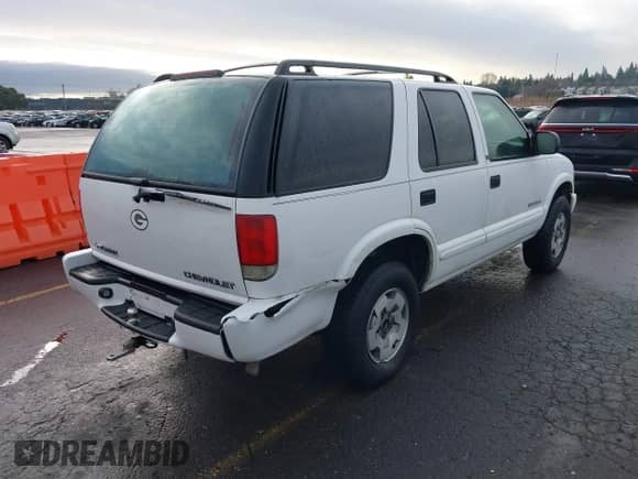 2003 Chevrolet Blazer LS with VIN 1GNDT13X63K145986, listed as a IAAI auction lot 41604061 with 158,431 mi miles and . Bid and sale history available at DreamBid. Image 4.