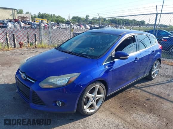 2013 Ford Focus Titanium with VIN 1FADP3N28DL262254, listed as a IAAI auction lot 43064485 with 144,283 mi miles and . Bid and sale history available at DreamBid. Image 2.