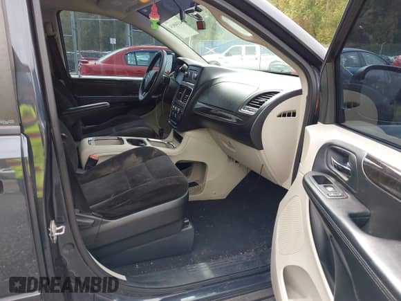 2014 Dodge Grand Caravan SXT with VIN 2C4RDGCG9ER245423, listed as a IAAI auction lot 43340034 with 228,584 mi miles and . Bid and sale history available at DreamBid. Image 5.