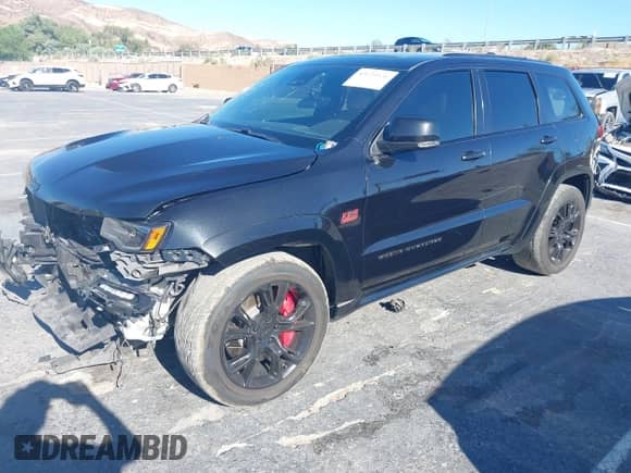2016 Jeep Grand Cherokee SRT with VIN 1C4RJFDJ3GC404557, listed as a IAAI auction lot 43124966 with 112,863 mi miles and . Bid and sale history available at DreamBid. Image 18.