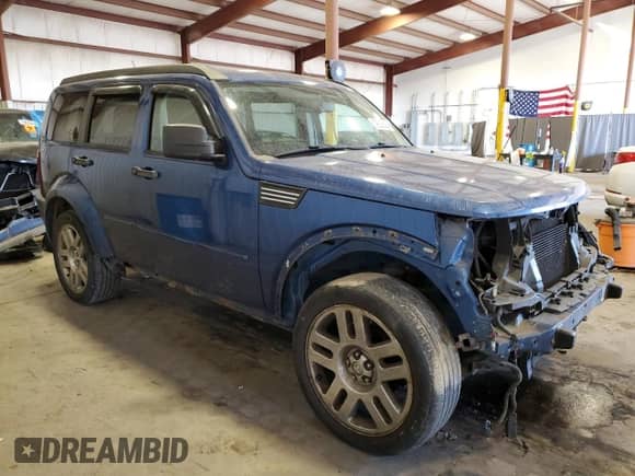 2009 Dodge Nitro SLT with VIN 1D8GU58K99W542909, listed as a Copart auction lot 79526084 with 172,511 mi miles and Salvage title. Bid and sale history available at DreamBid. Image 4.