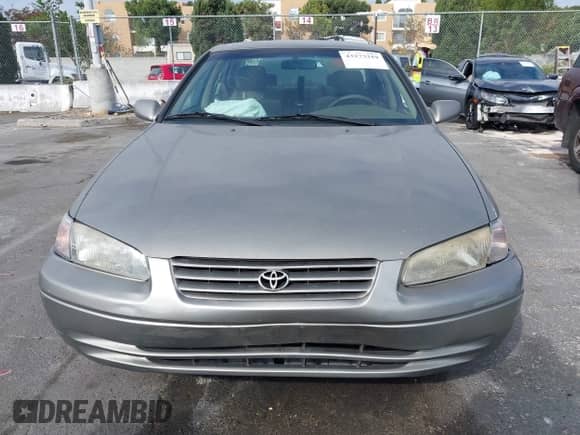 1998 Toyota Camry LE z VIN JT2BG22K5W0120831, wystawiony jako IAAI lot #43273319 z przebiegiem 197 465 mil mil oraz . Historia ofert i sprzedaży dostępna na DreamBid. Obrazek 12.