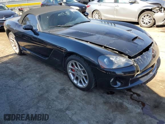 2004 Dodge Viper SRT-10 with VIN 1B3JZ65Z44V101704, listed as a Copart auction lot 71448694 with 62,624 mi miles and Salvage title. Bid and sale history available at DreamBid. Image 4.