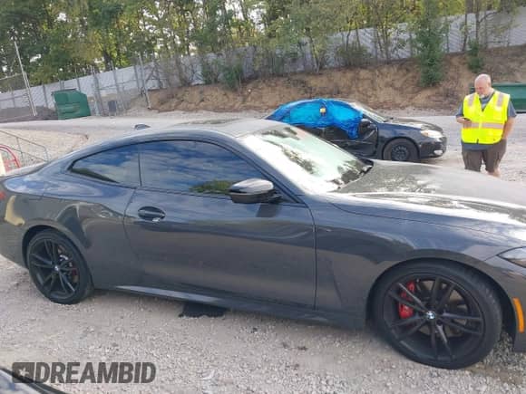 2022 BMW 4 Series M440i xDrive with VIN WBA13AR04NCK77385, listed as a IAAI auction lot 43099478 with 50,502 mi miles and . Bid and sale history available at DreamBid. Image 13.