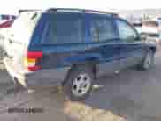 2002 Jeep Grand Cherokee Sport with VIN 1J4GW38S32C181840, listed as a IAAI auction lot 43237876 with 157,878 mi miles and . Bid and sale history available at DreamBid. Image 4.