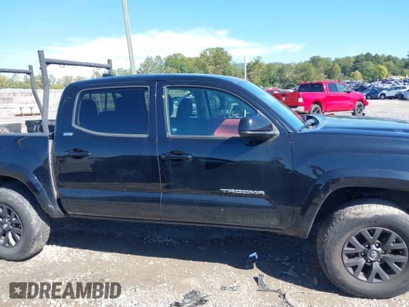 2021 Toyota Tacoma SR with VIN 5TFCZ5AN4MX273658, listed as a IAAI auction lot 43334186 with 70,498 mi miles and . Bid and sale history available at DreamBid. Image 13.