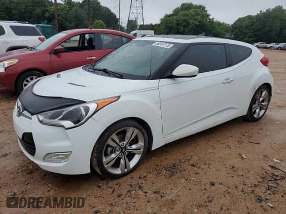 2013 Hyundai Veloster w/Black Int с VIN KMHTC6AD0DU149690, выставлен на аукционе Copart как лот 68201775 с пробегом 112 030 миль миль и Списание • Salvage title. История ставок и продаж доступна на DreamBid. Изображение 1.