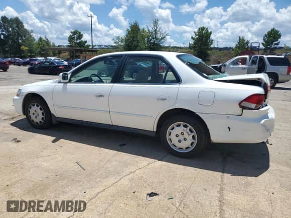 2002 Honda Accord LX with VIN JHMCG56482C030489, listed as a Copart auction lot 66217045 with 124,672 mi miles and Salvage title. Bid and sale history available at DreamBid. Image 2.