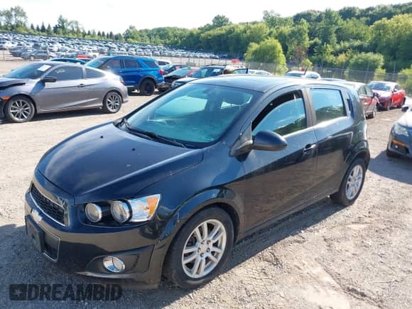2014 Chevrolet Sonic LT with VIN 1G1JC6SB5E4156606, listed as a IAAI auction lot 43067636 with 148,537 mi miles and . Bid and sale history available at DreamBid. Image 2.